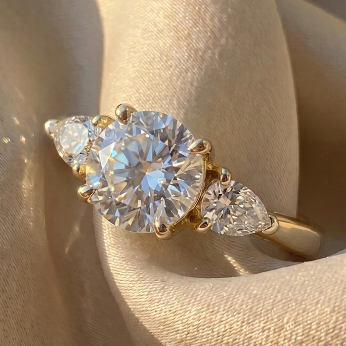 Round three stone engagement ring